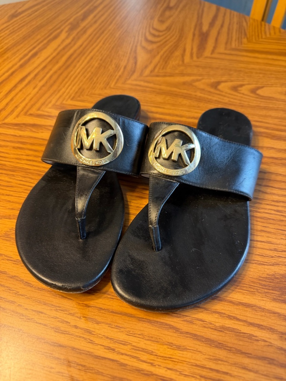 Michael Kors Black Leather Thong Sandals with Gold MK Medallions